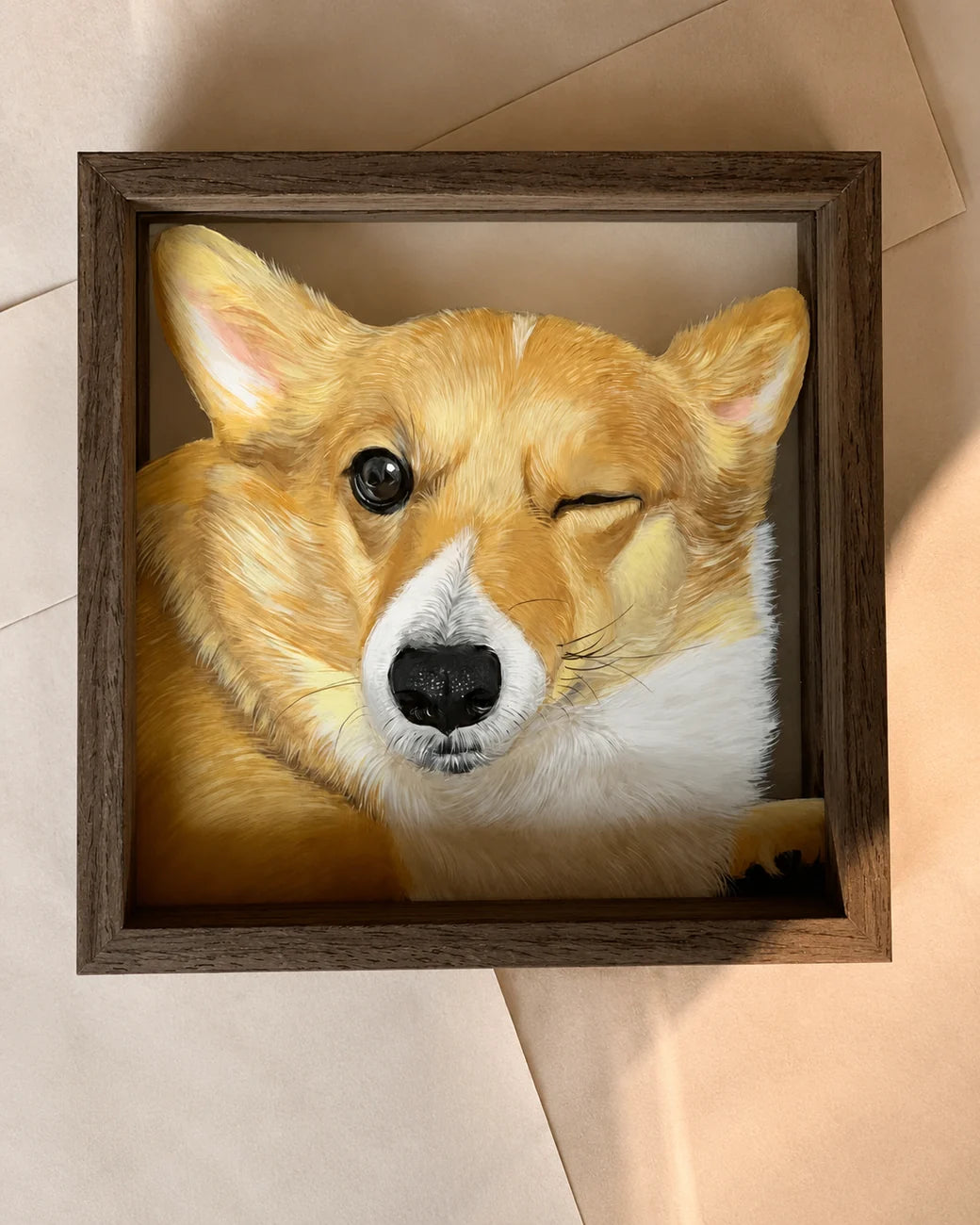 Close glass portrait of a corgi in a frame