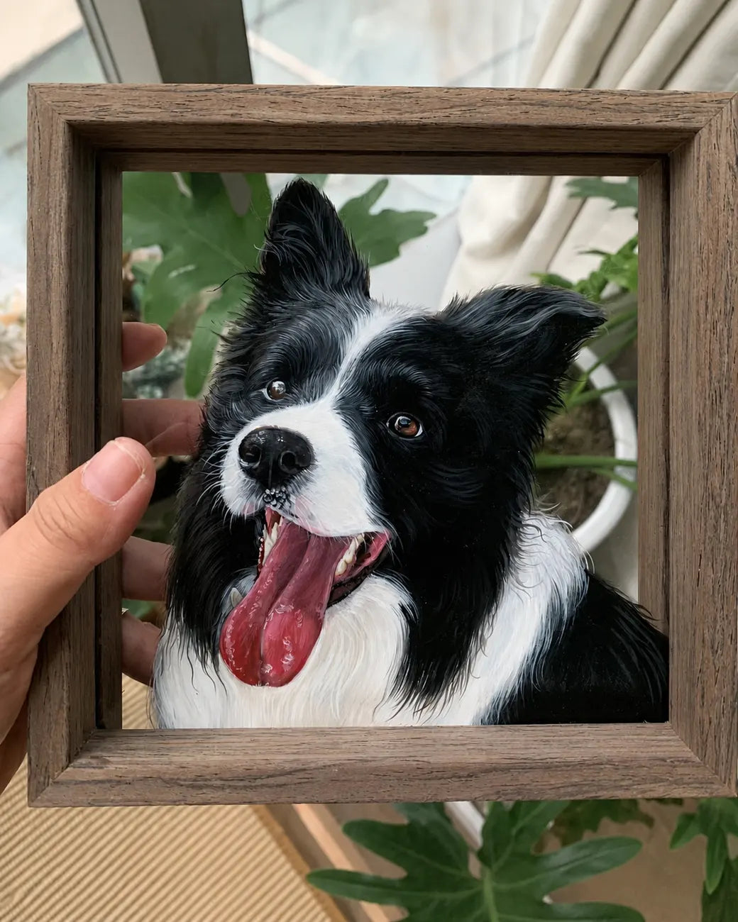 Finished border collie glass portrait held by hand