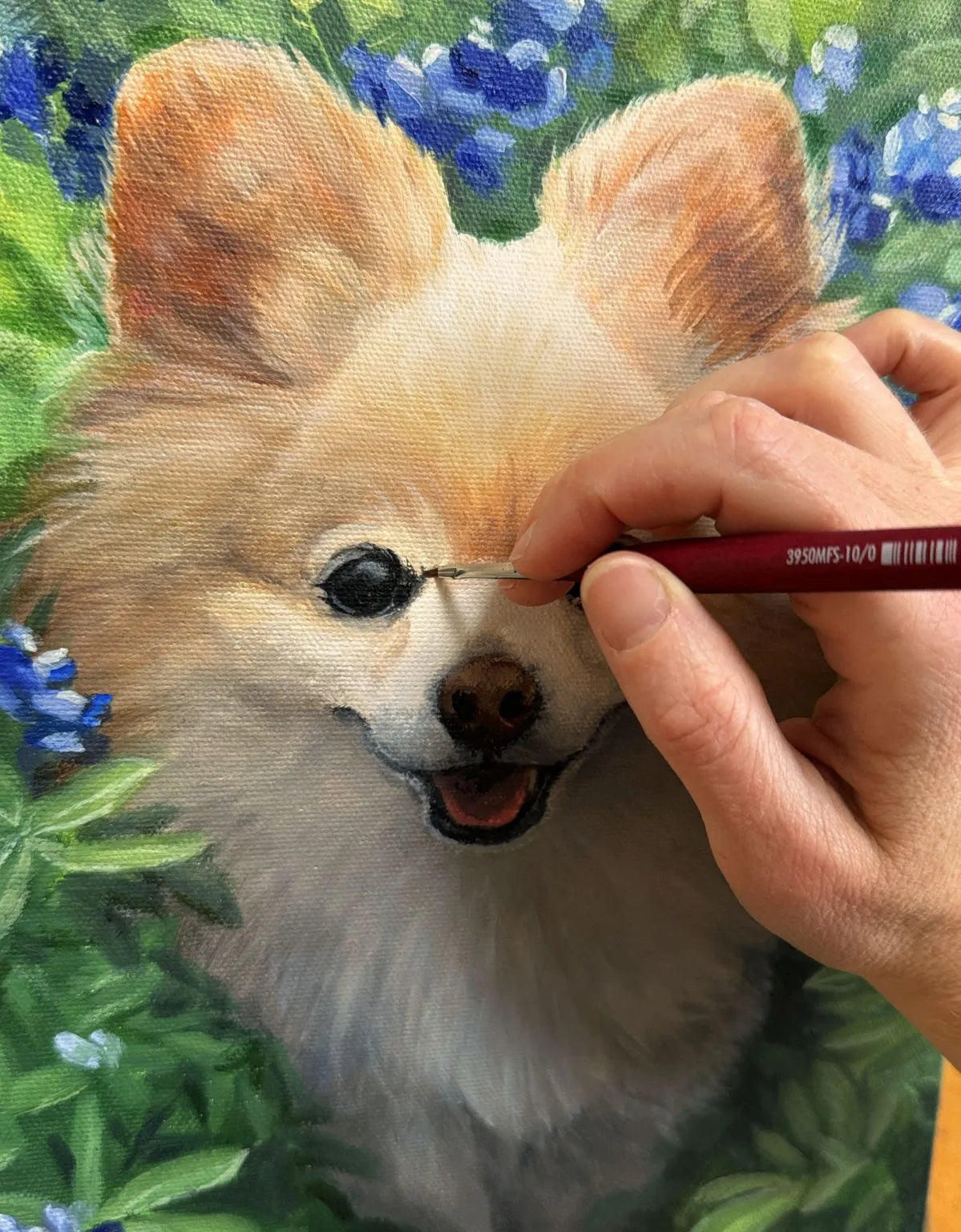 Detail of a hand-painted pet portrait on glass