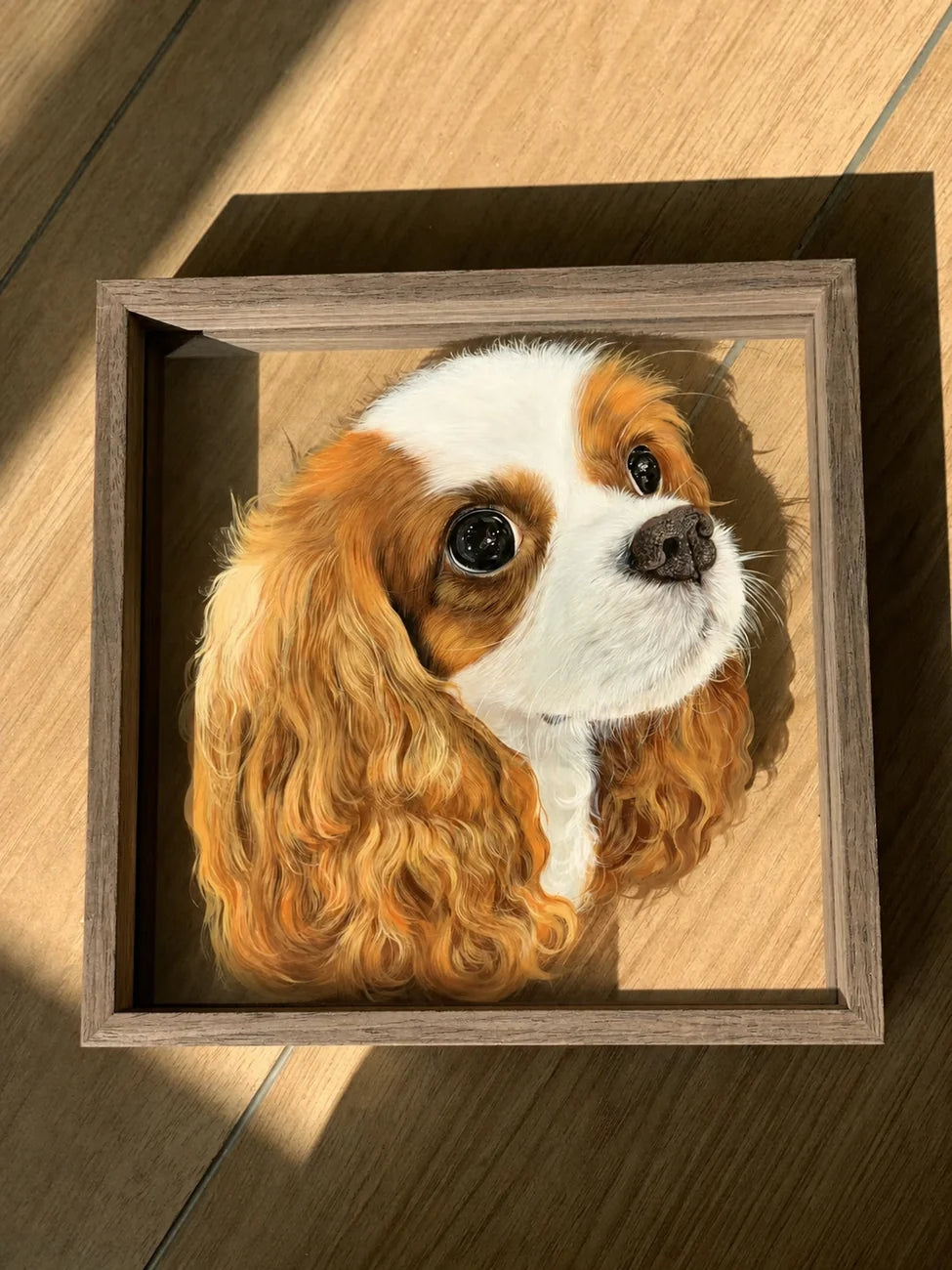 Finished Cavalier glass pet portrait in a wood frame