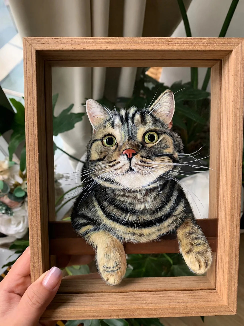 Tabby cat glass portrait held in a wood frame