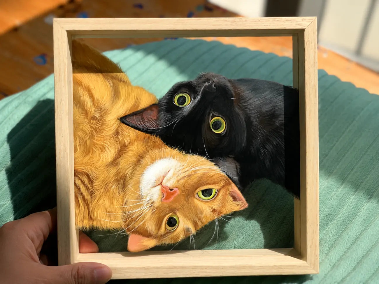 Finished two-cat glass portrait in a wood frame