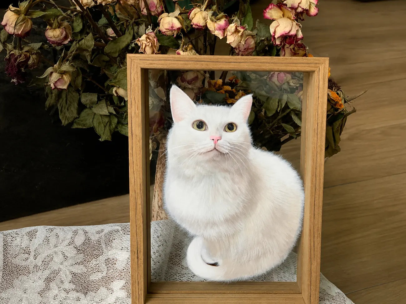 Finished white cat glass portrait in a light wood frame